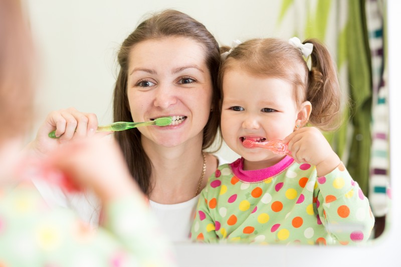 Child receiving dental bonding treatment