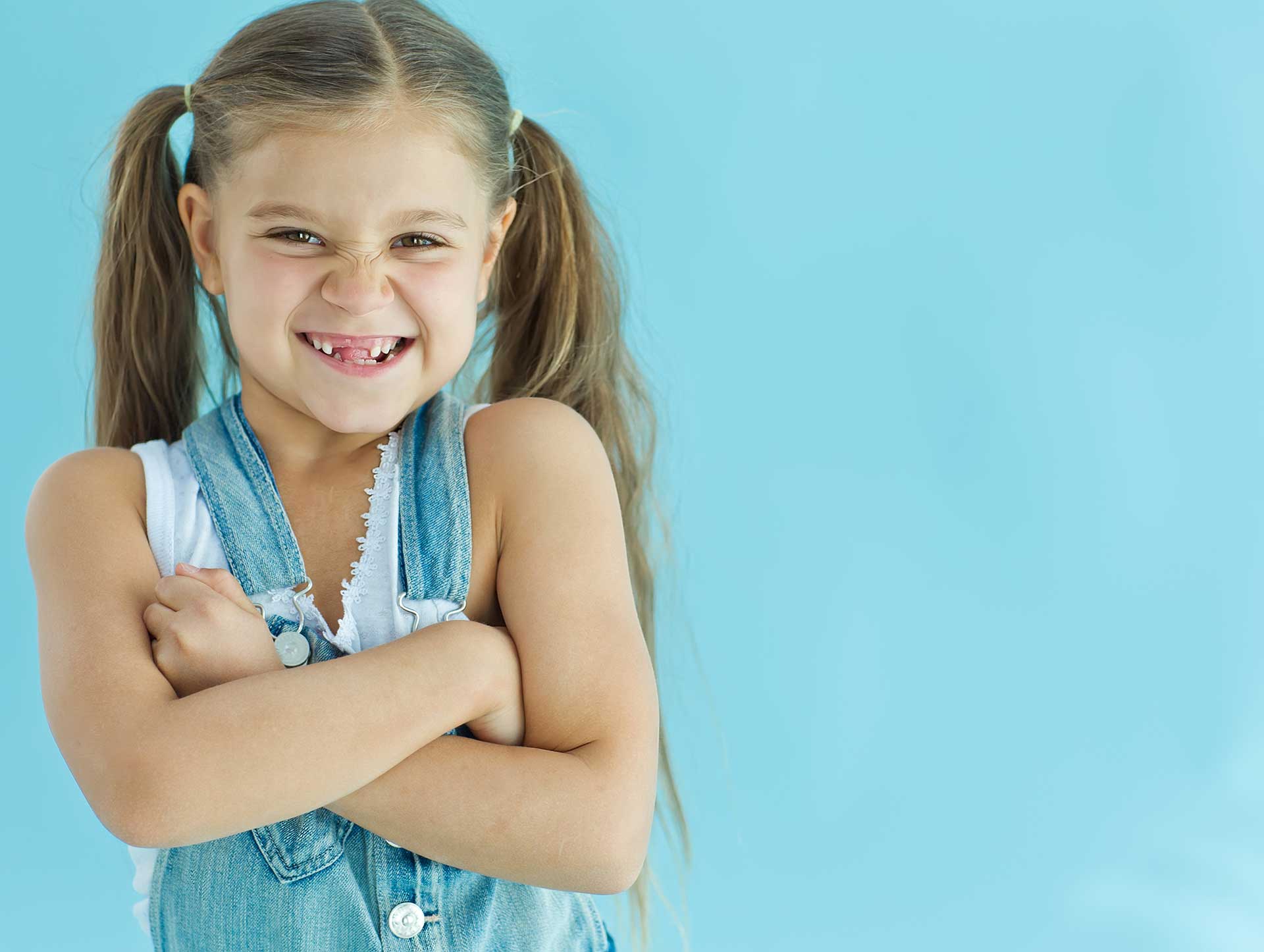 Child receiving fluoride treatment at pediatric dental office