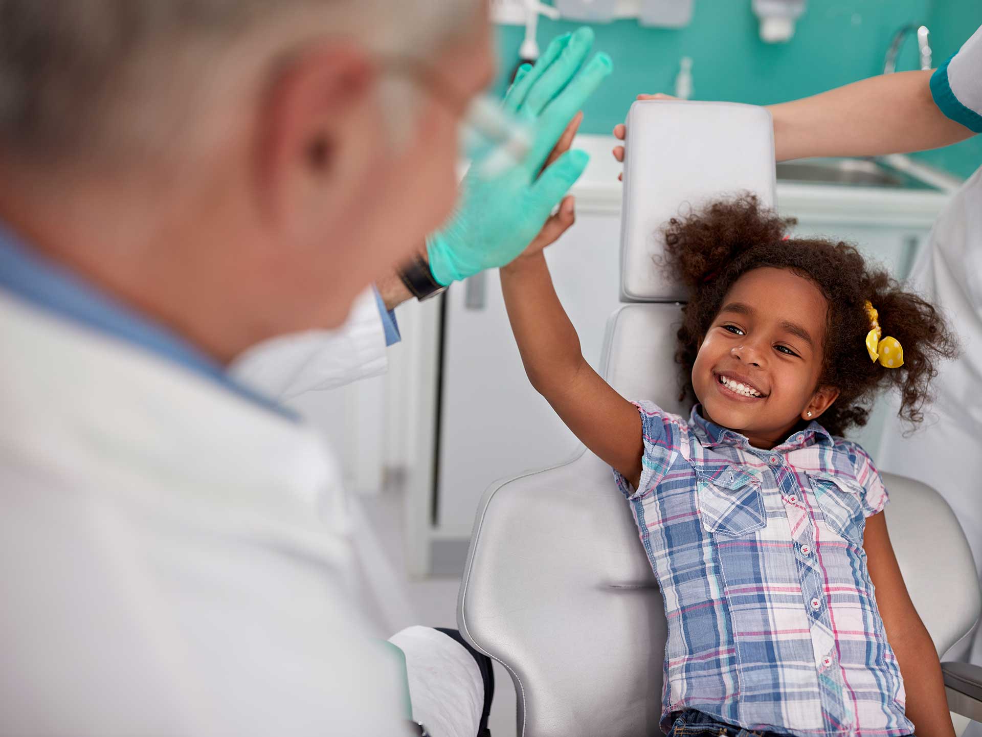 Child receiving dental filling treatment at a pediatric dentist